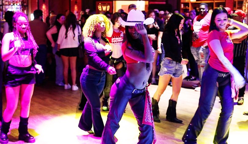 image of girls dancing inside pbr louisiana