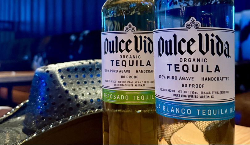 image of a black cowboy hat and two bottles of dulce vida tequila