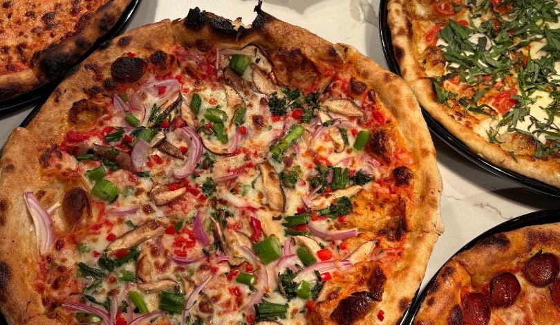 image of four pizzas