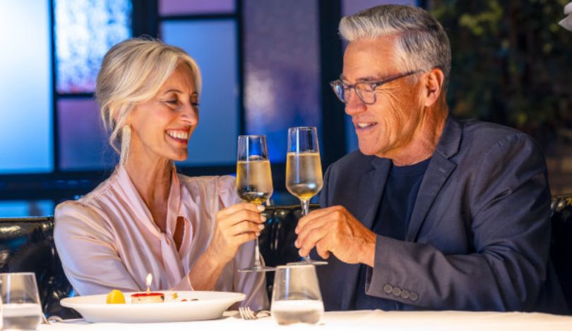 image of a couple toasting glasses of champagne