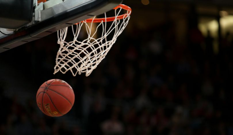 image of basketball coming out of a hoop