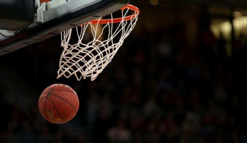 image of basketball coming out of a hoop