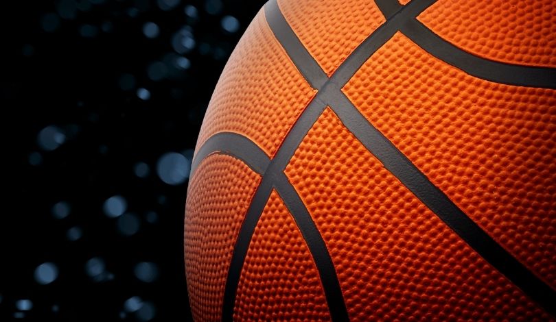 image of a basketball with blue dots around it