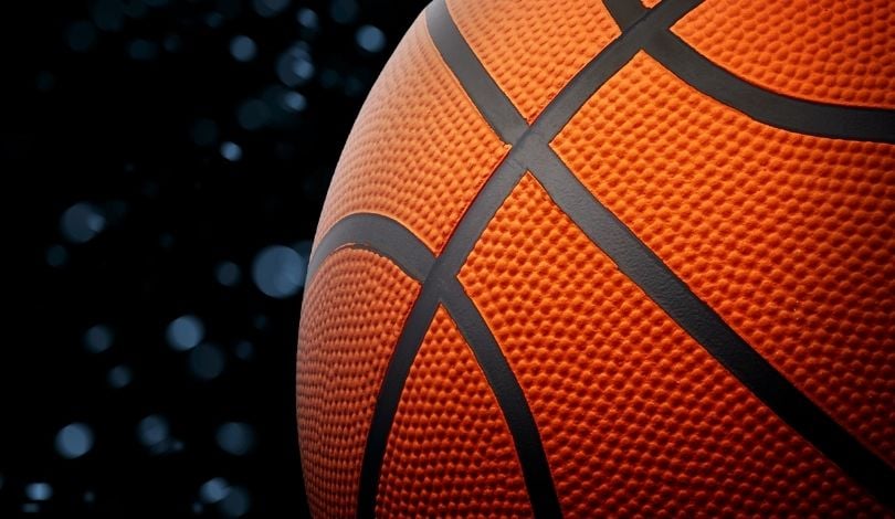 image of a basketball with blue dots around it