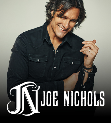 Man in a black button up shirt with swoopy black hair named Joe Nichols