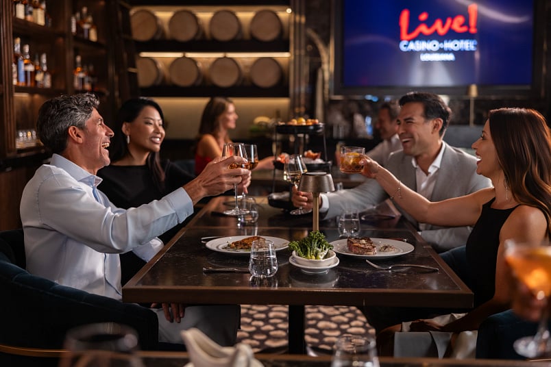 Two couples having dinner and drinks at Prime Rib