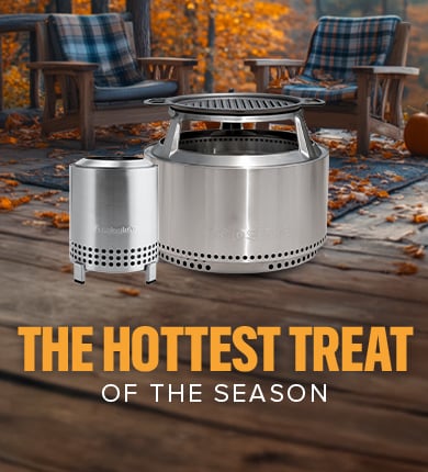 round metal solo stove with fire buring