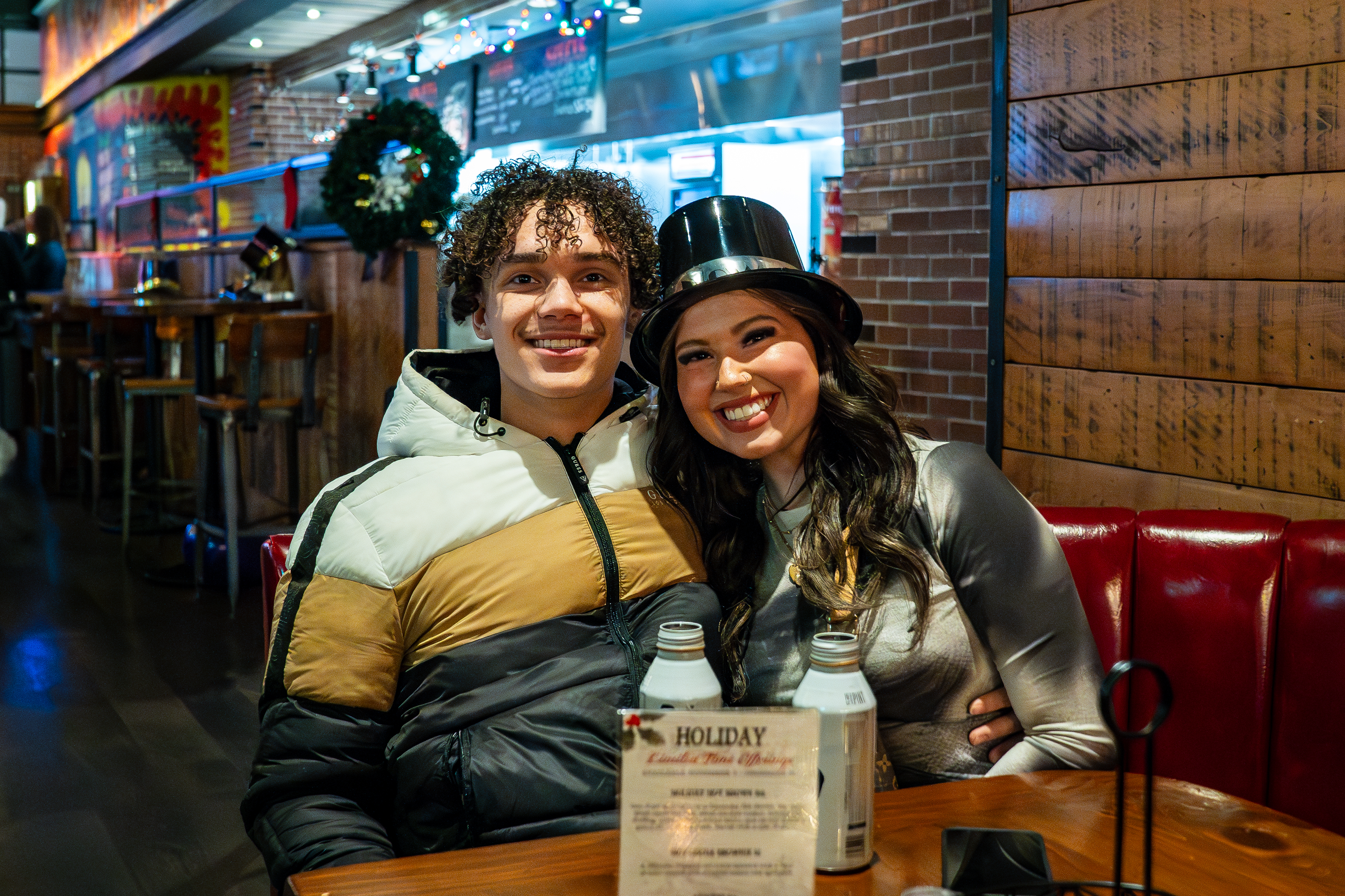 A couple sitting at Guy Fieri's Smokehouse.