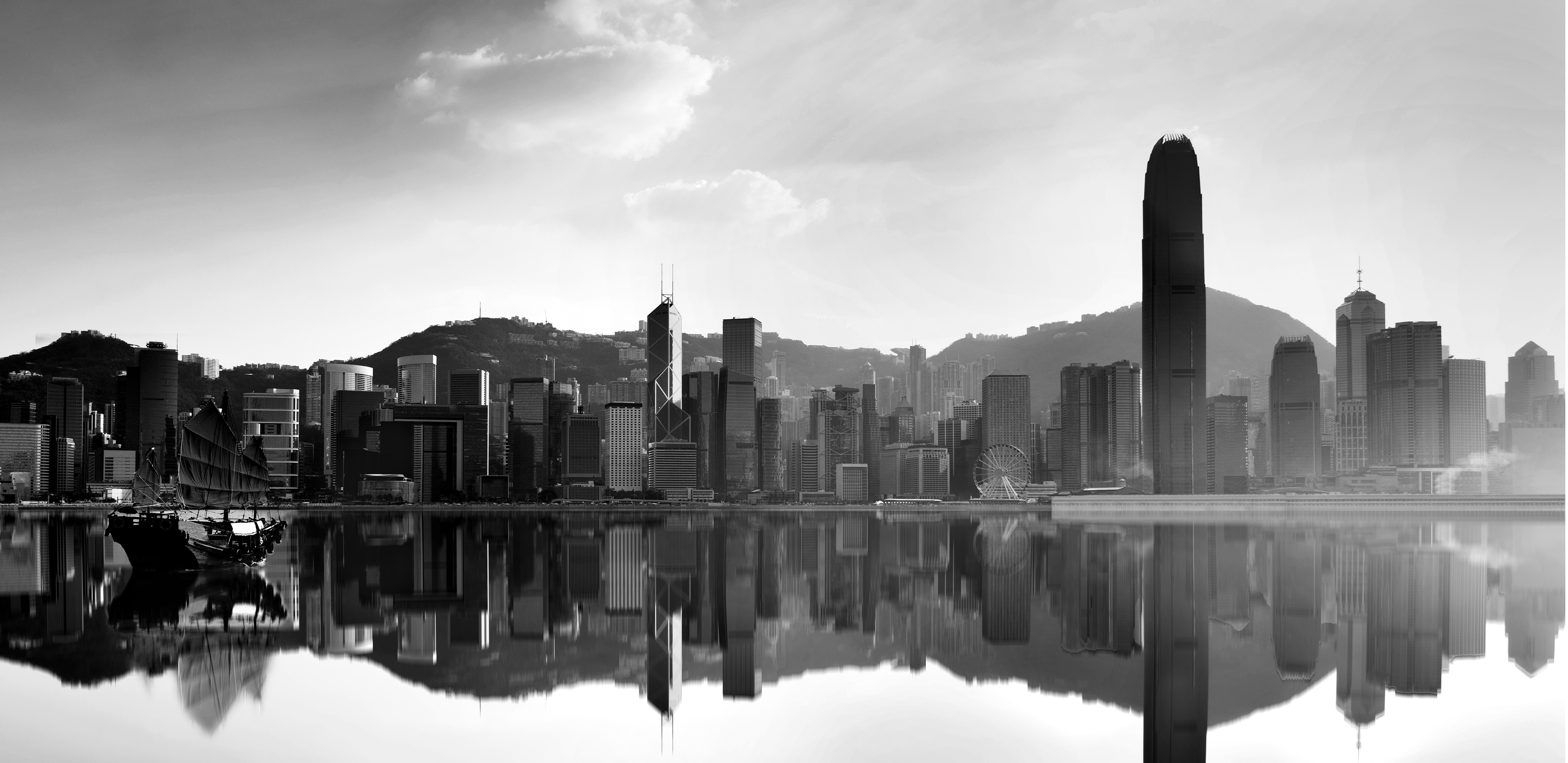 Junk boat crossing Hong Kong harbor