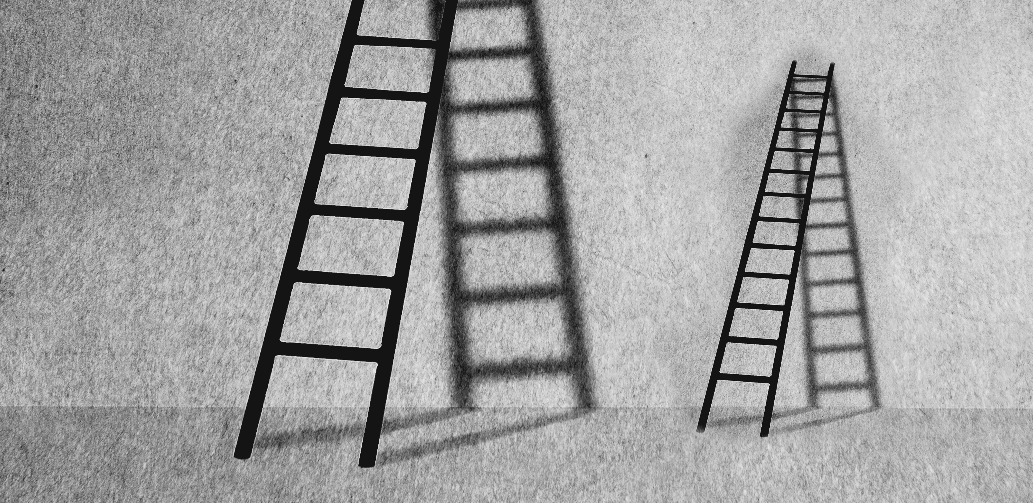 two ladders leaning against a wall