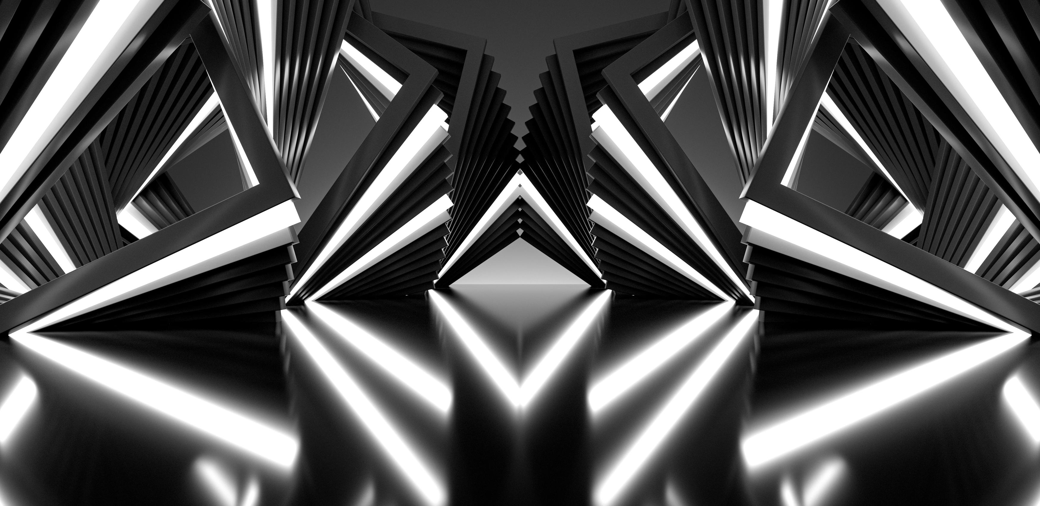 White neon lights in a dark room, with light bouncing off a dark shiny floor