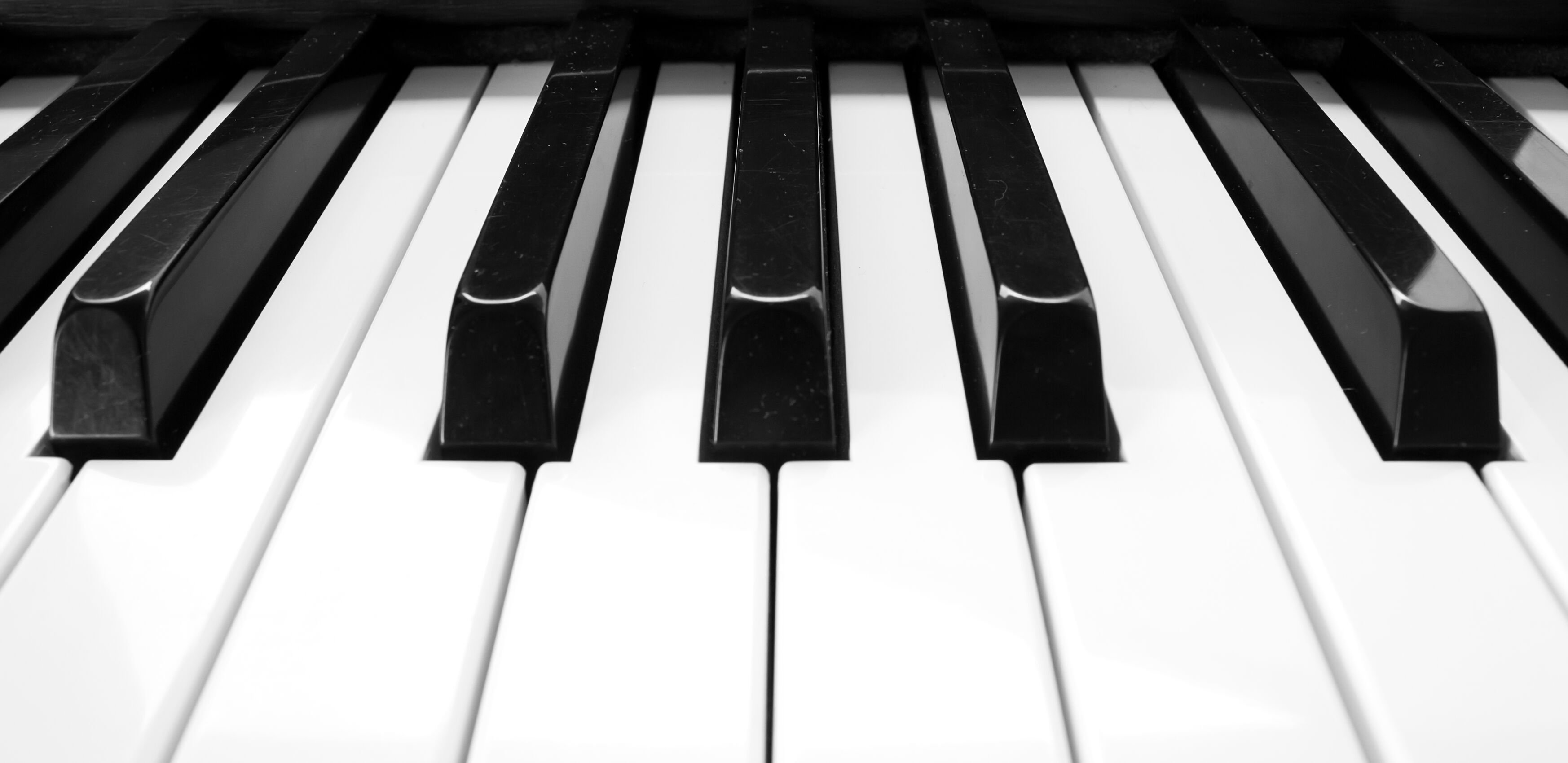 A close up image of a piano, in black and white