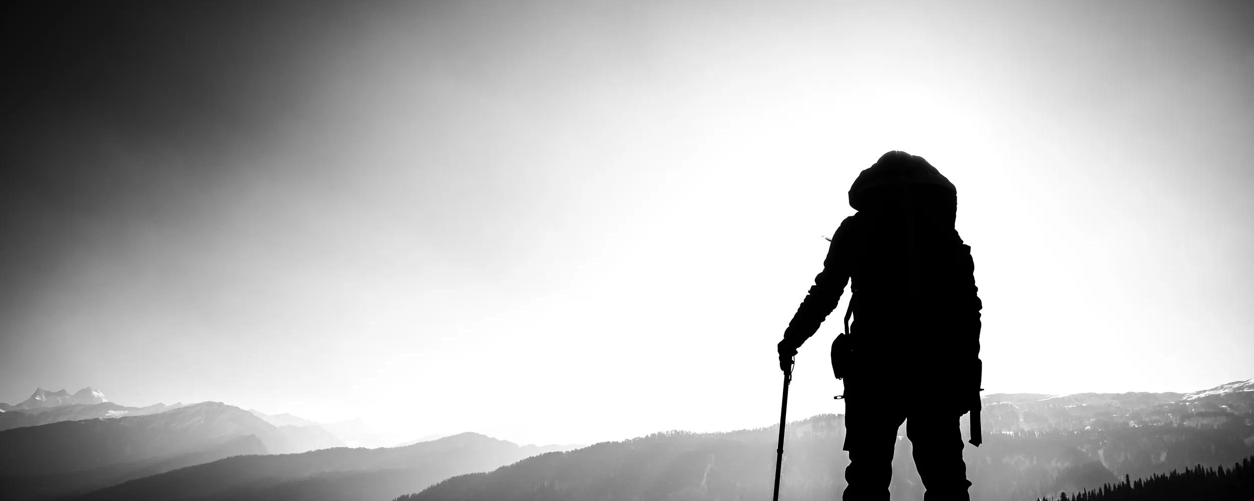 A silhouette of an accomplished mountain hiker in the Himalayan mountains.