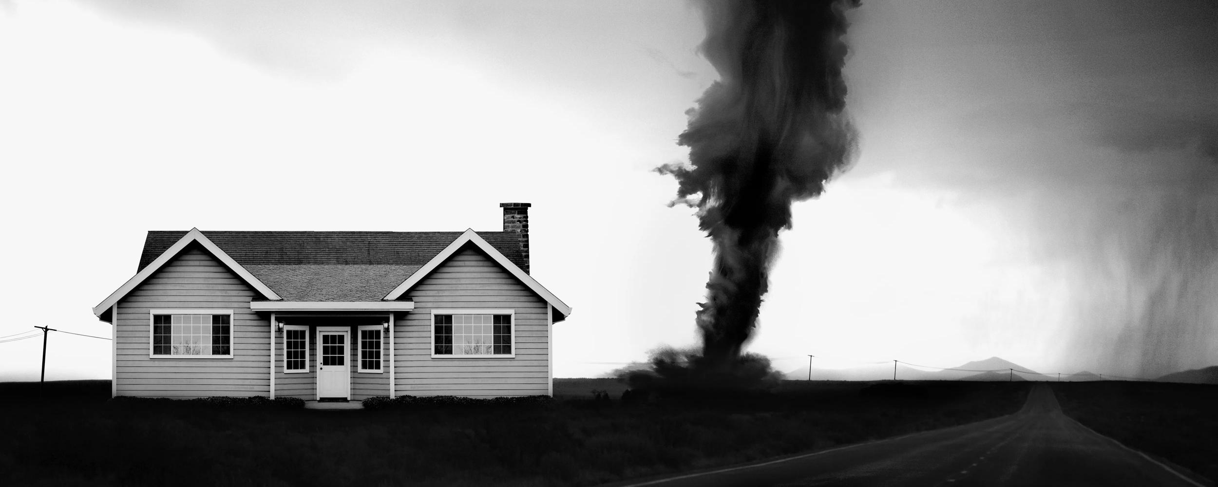 A twister behind a small house