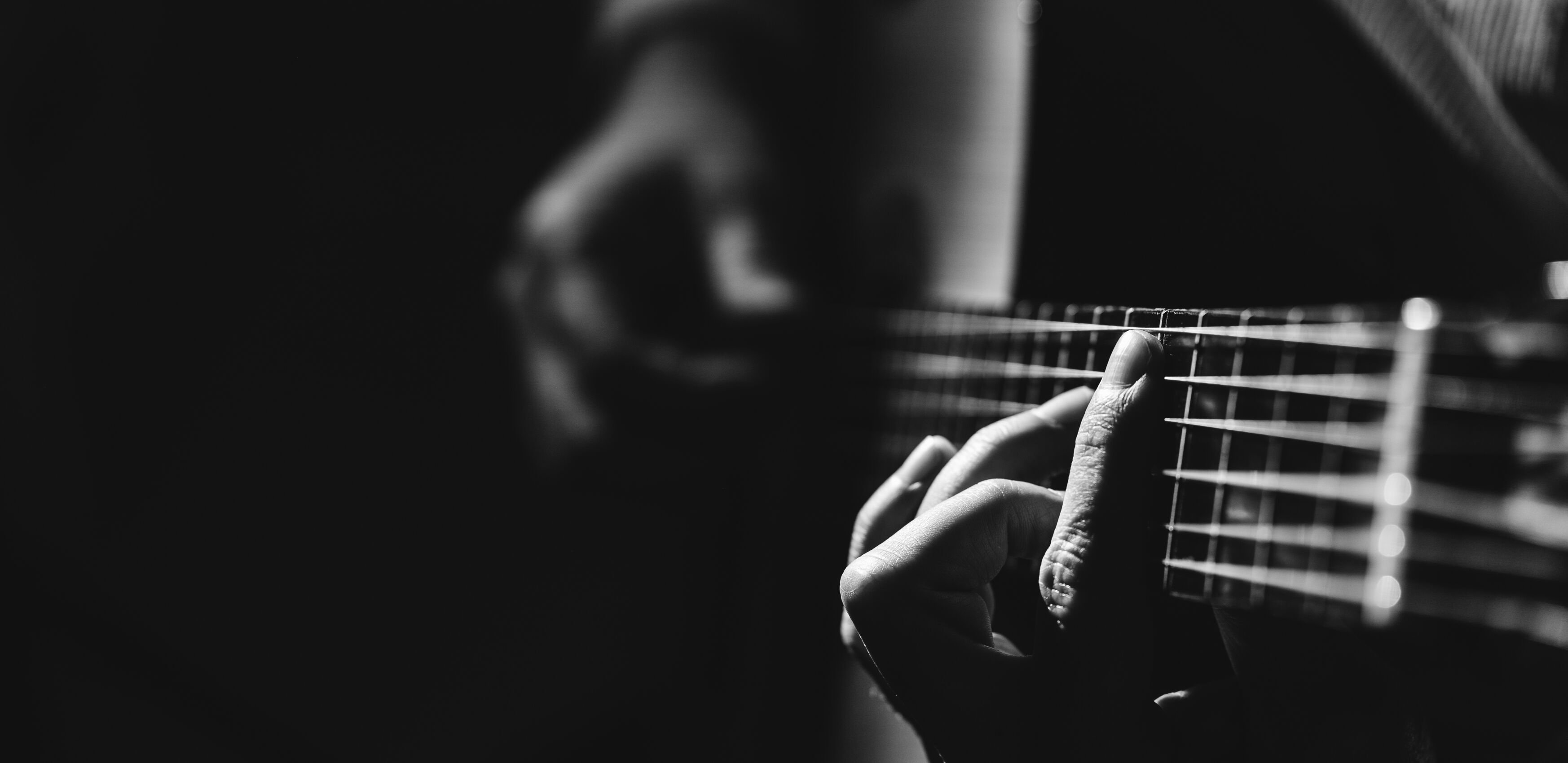 A close up image of a guitar being played
