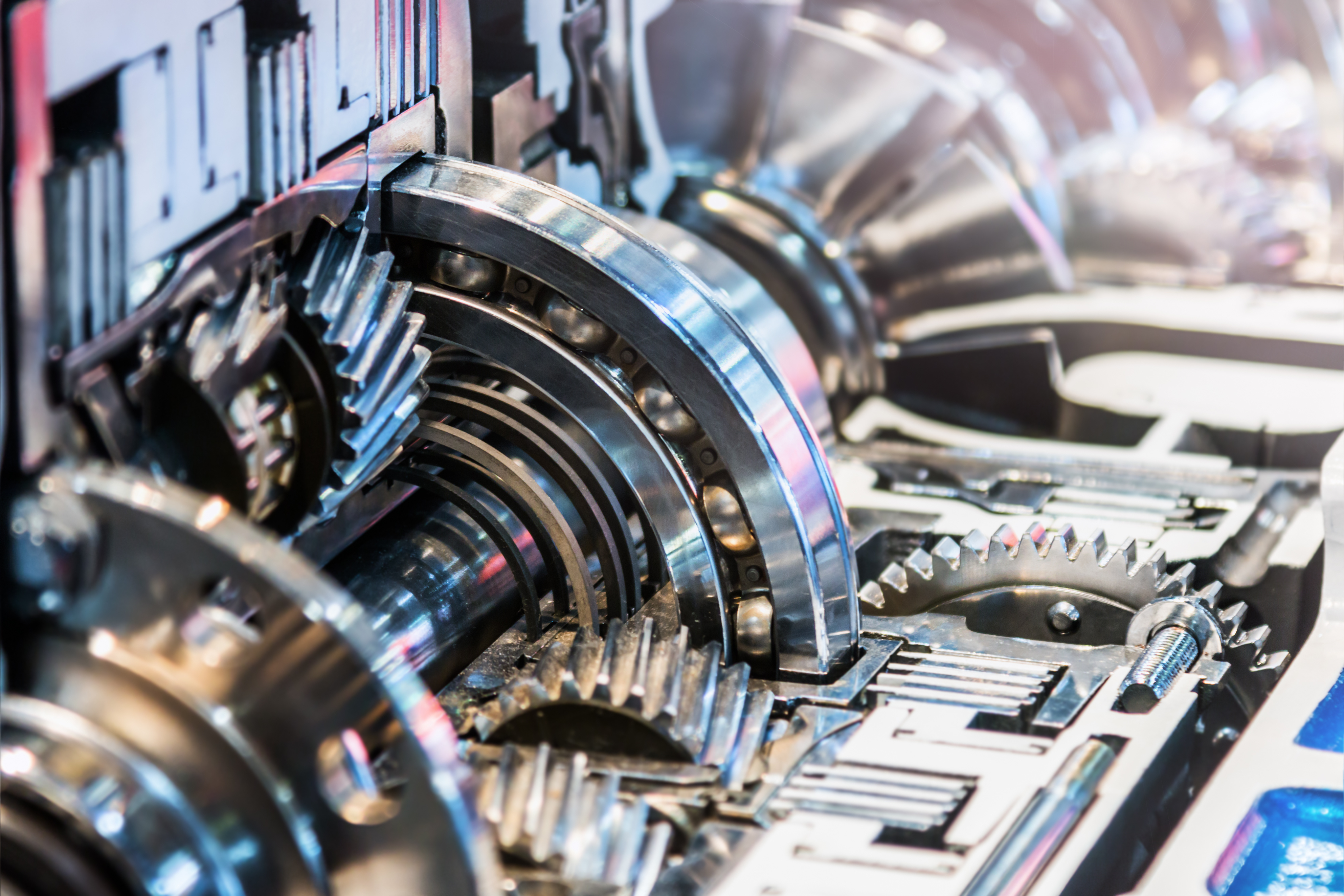A close up of a gearbox showing the intricate workings of the gears and bearings.