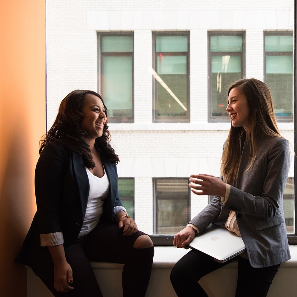 This is an image of two women talking