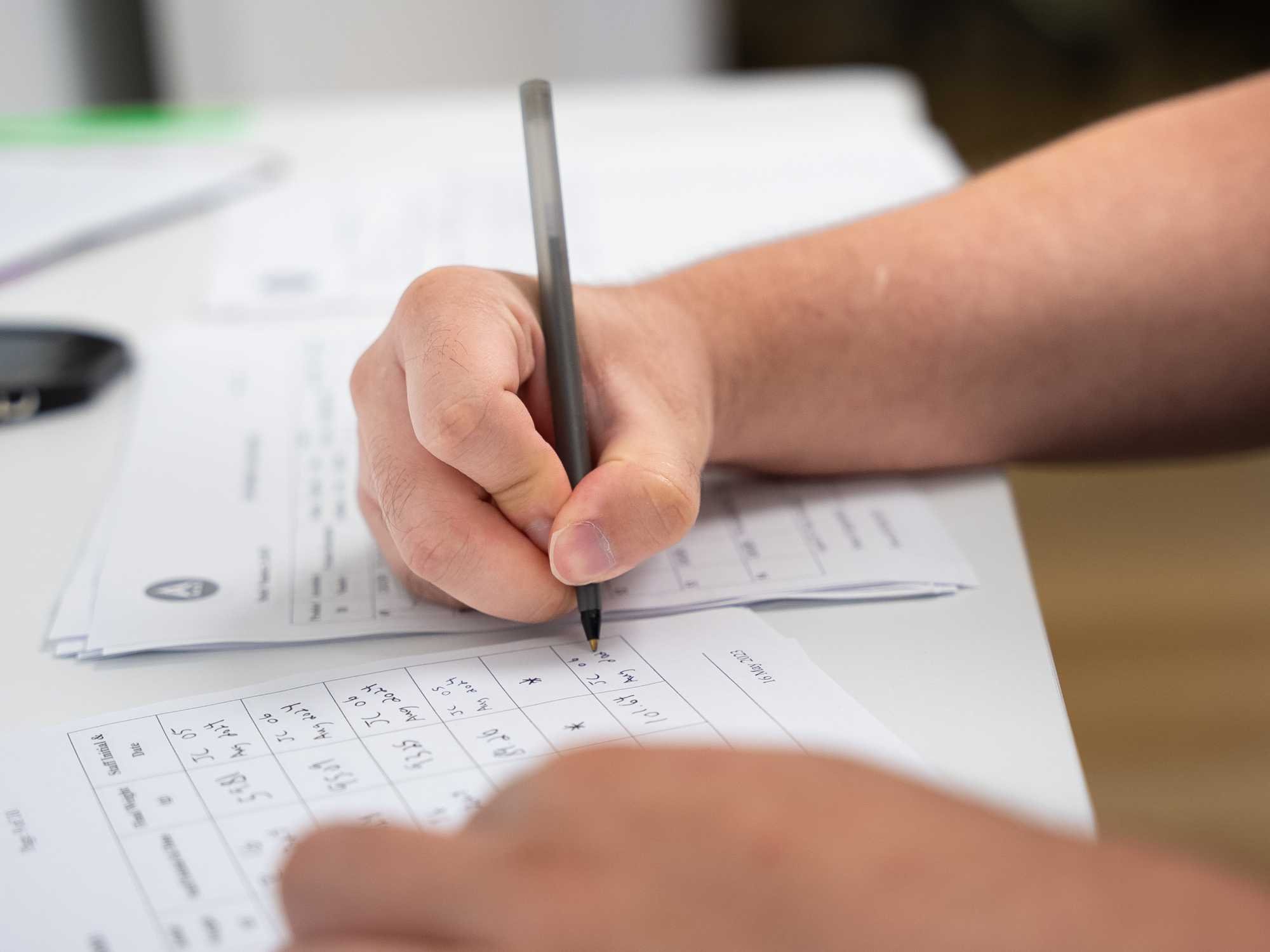 Clinical testing panelist filling out forms