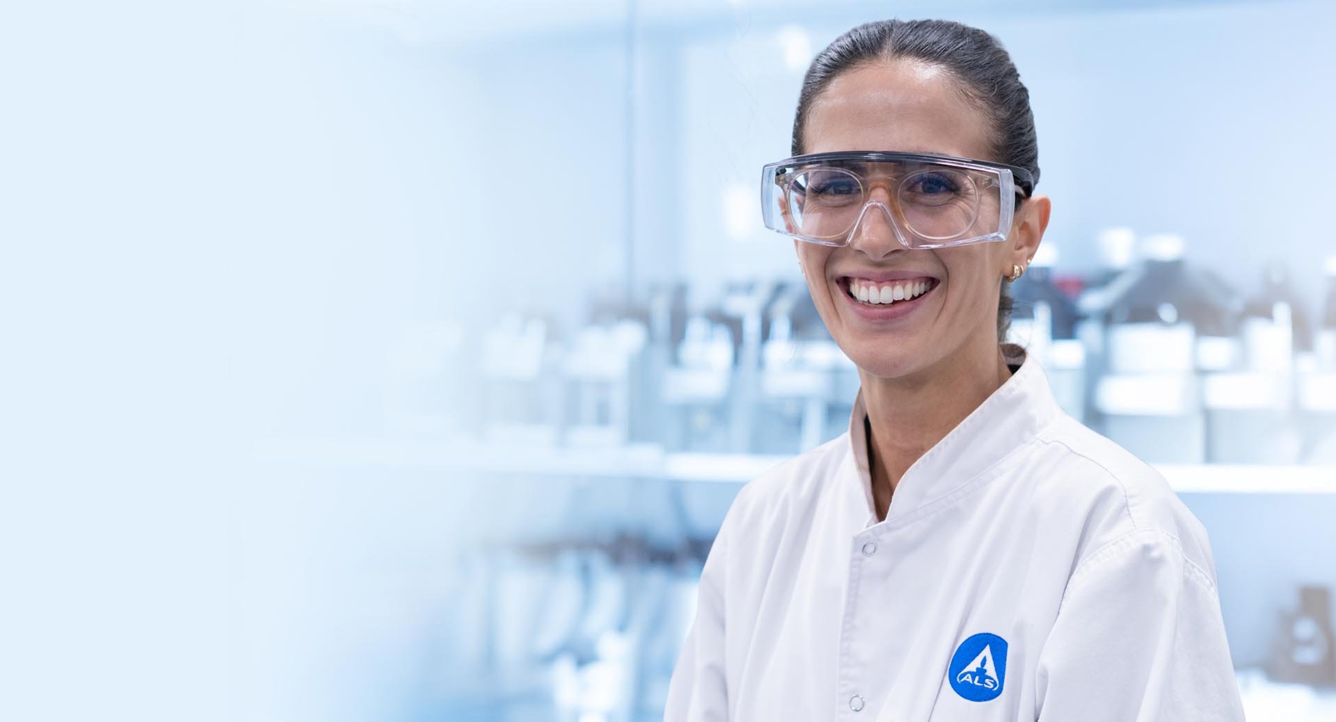 Worker in laboratory standing in front of fridge
