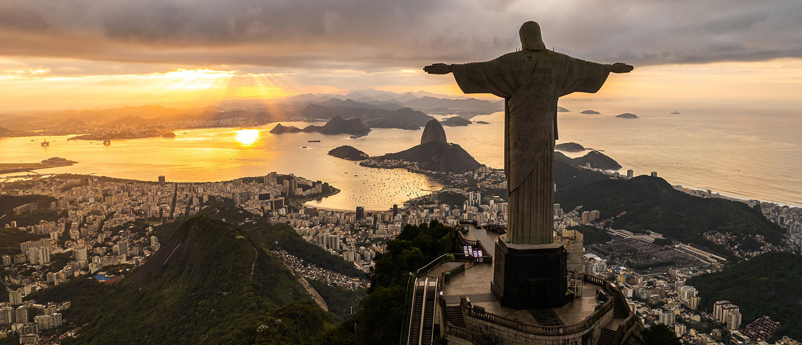 The iconic Christ the Redeemer statue stands atop a mountain overlooking the city of Rio de Janeiro, Brazil.