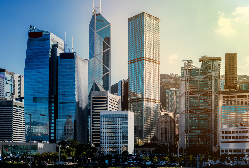 The image shows an urban skyline with a cluster of skyscrapers in the foreground.