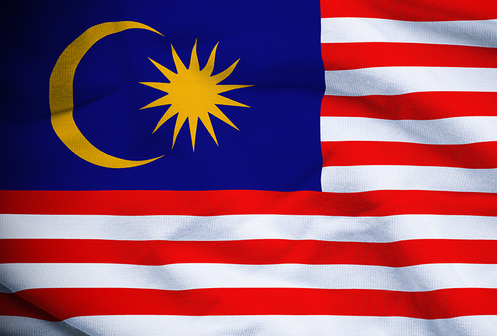 The flag of Malaysia has a blue field with a crescent and a yellow star and red and white stripes.