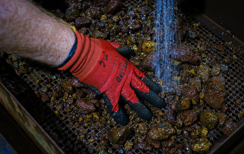 Metallurgist examines ore