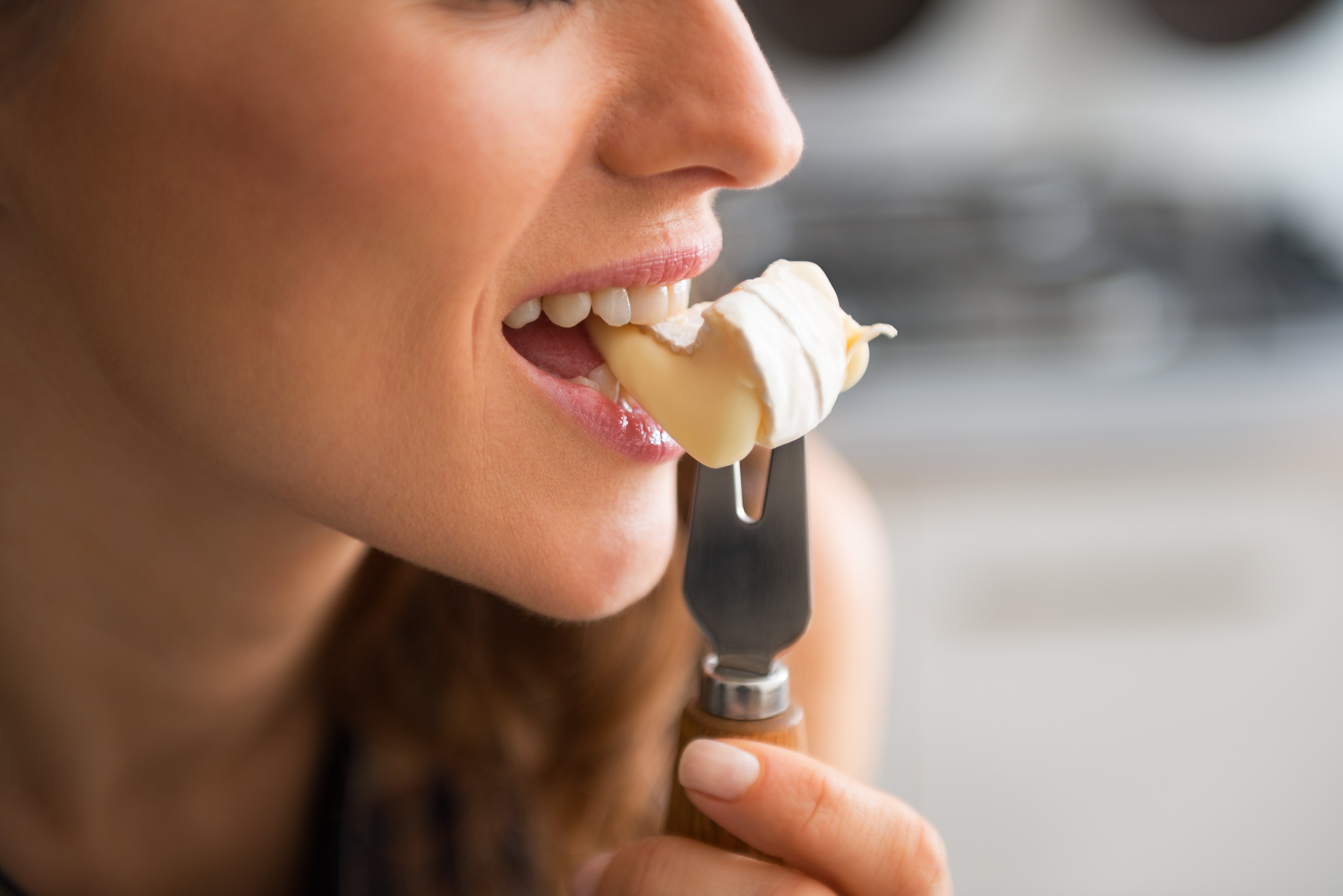 testing texture and taste of food on fork