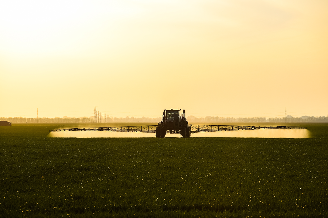 image of pesticide sprayer in a field
