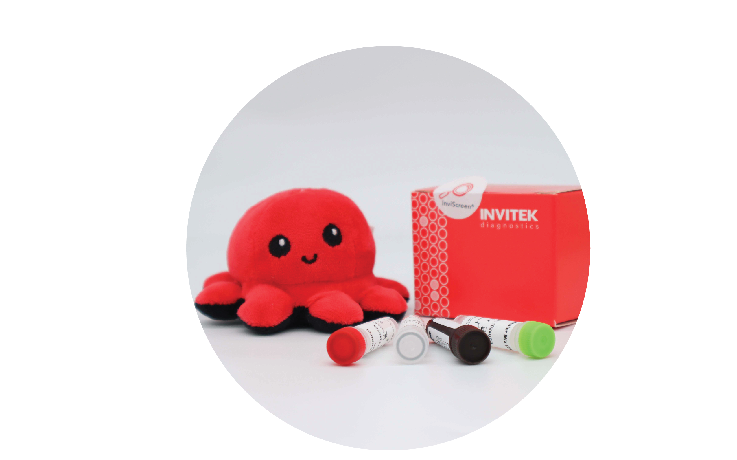INVITEK InviScreen Hepatitis A kit: red diagnostics box with plush octopus mascot “Invi” behind four upright control vials; (red, dark, white, green caps) lie in front on white surface.