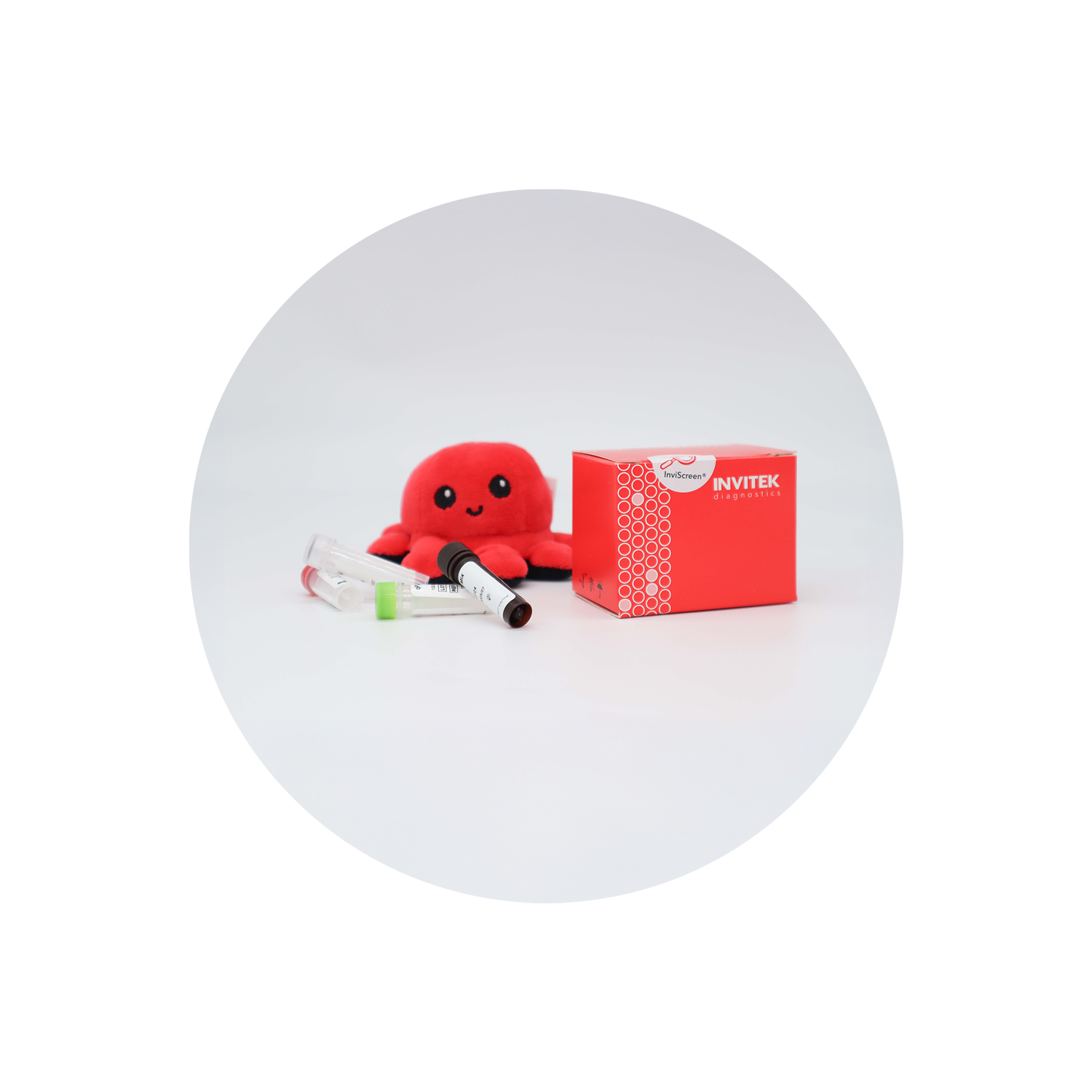 Plush red octopus mascot “Invi” and a red INVITEK diagnostics box sit on a white surface, with several color‑capped reagent vials (green, red, brown, clear) scattered in front, all framed by rounded white corners.