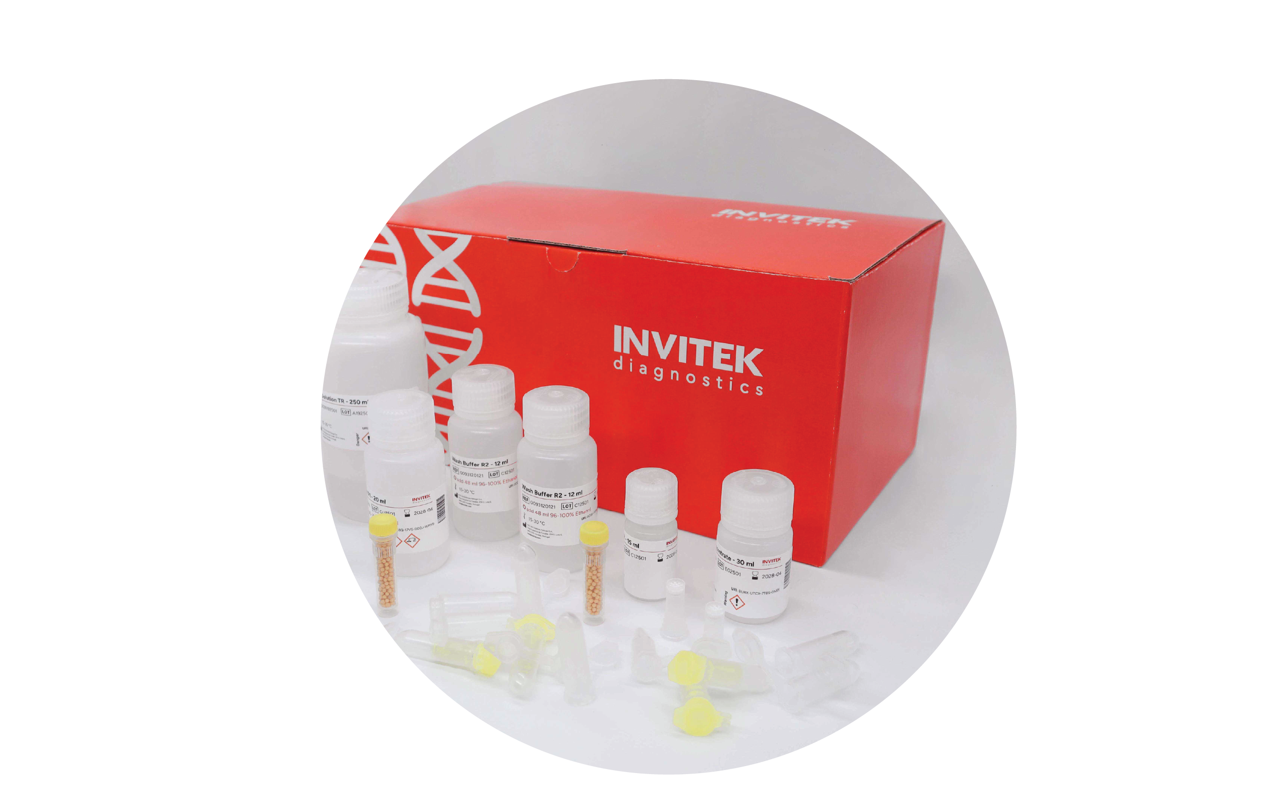 Red Invitek Diagnostics InviTrap Spin Universal RNA Mini Kit box behind reagent bottles, and color-coded reagent vials with yellow spin filters, and tubes laying scattered in front.