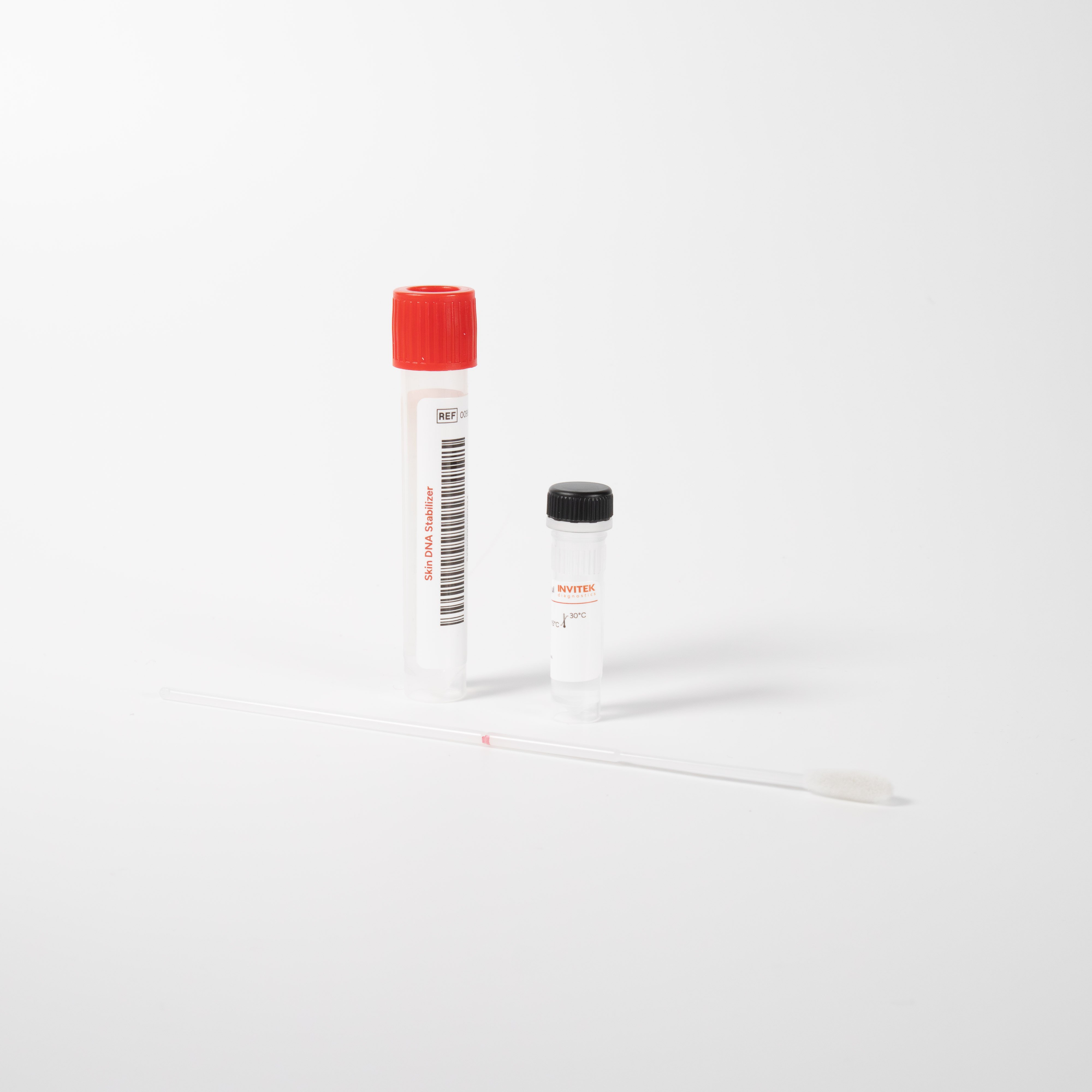 Skin DNA sample collection kit on a white background, showing a red-capped tube, a small black-capped vial, and a white swab laid in front.