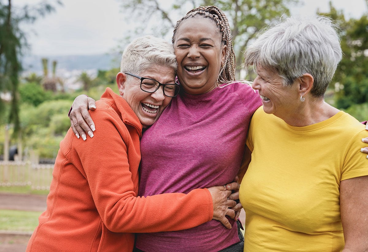 Happy senior women having fun together at a park