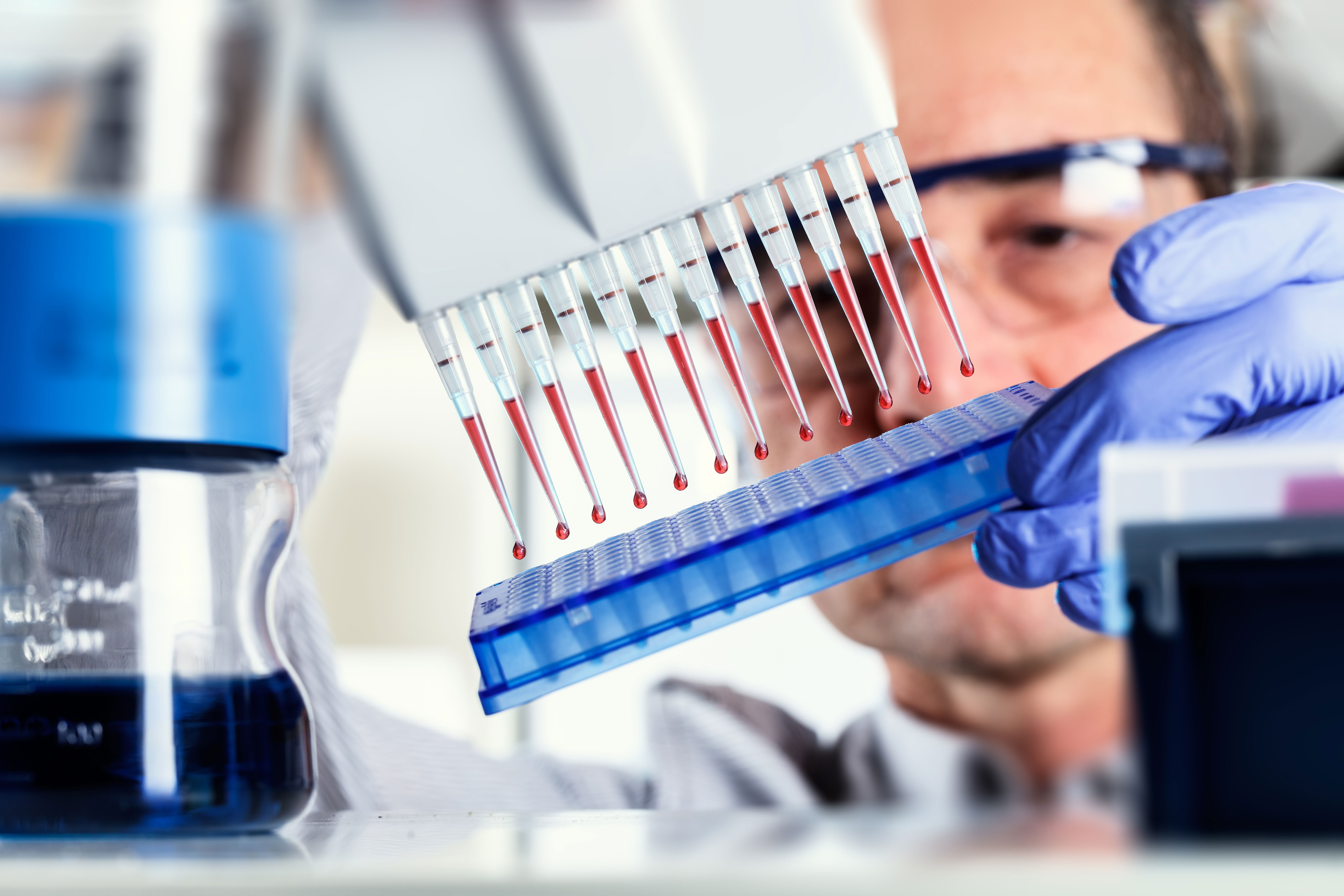Scientist uses multipipette during DNA research