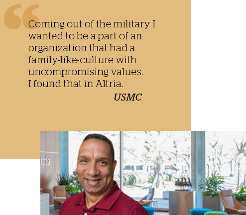 black male standing outside of building