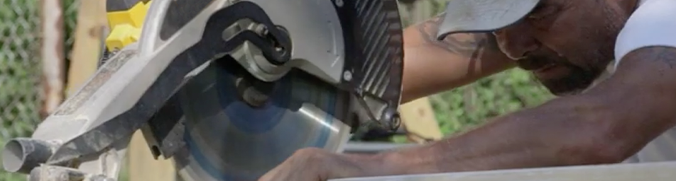 man using circular saw