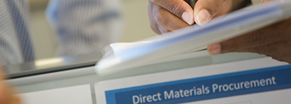 Approach to Conflict Minerals image - A brown hand holding papers over a white binder named “Direct Materials Procurement”
