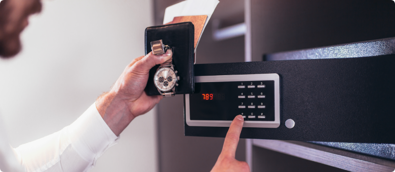 putting belongings in a safe