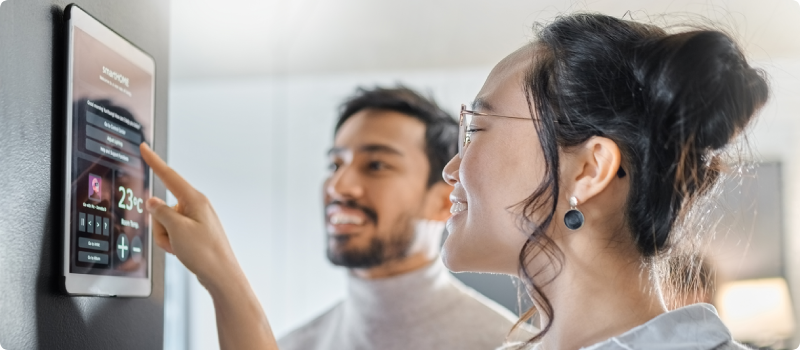 a couple using their smart home technology