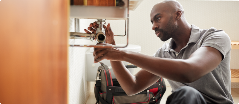 Plumber fixing a bathroom sink