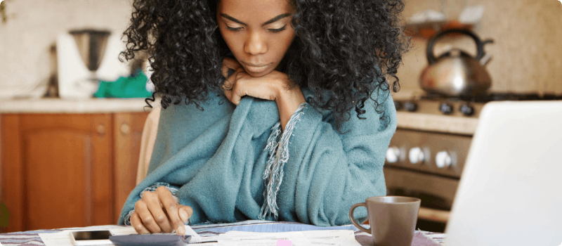 A person reviewing her bills.