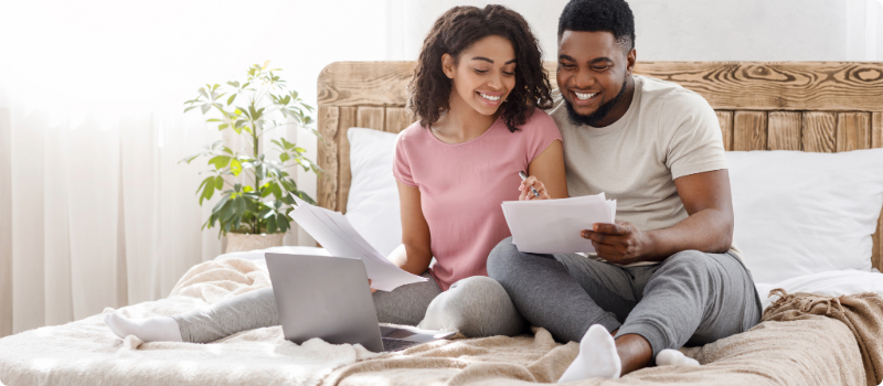 A couple reviewing their bills together.