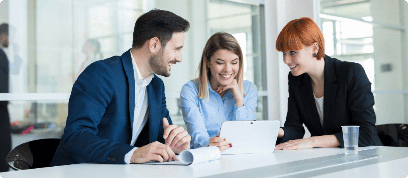 A couple meeting with their insurance agent. 