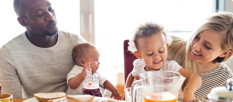 A small family eating breakfast together.