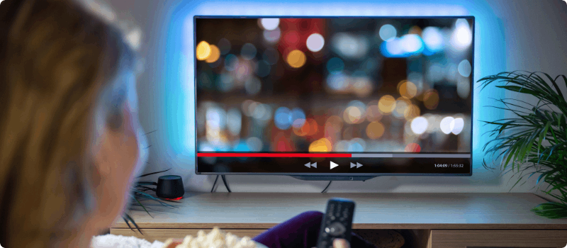 Person watching tv in her living room.