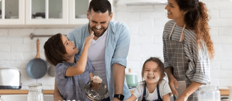 Happy family cooking together in the kitchen.