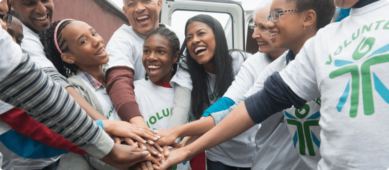 A group of volunteers cheering.