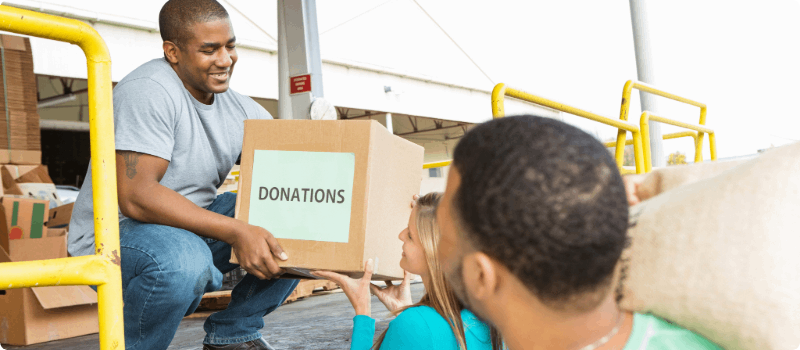 Volunteers unloading donation boxes.