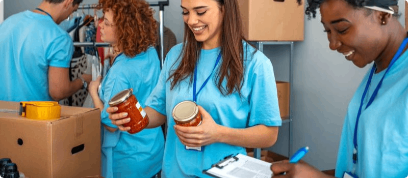 Volunteers sorting food at a food bank.
